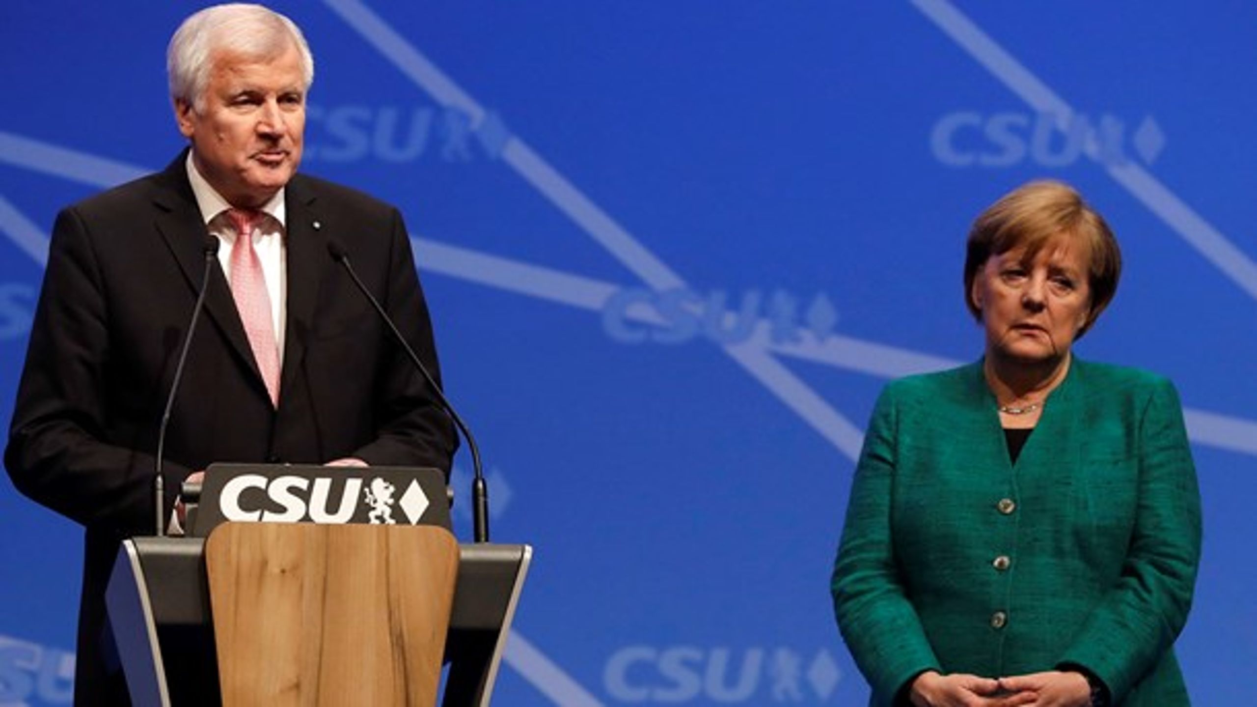 Angela Merkel og Horst Seehofer undgik med et kompromis en regeringskrise, der var blevet udløst af uenigheder om asylpolitikken.